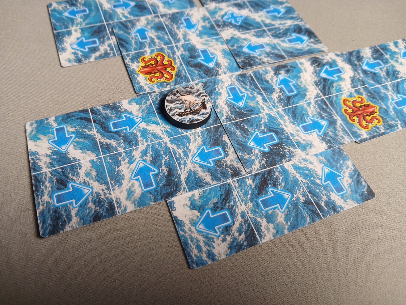 Close-up of the ocean cards and ship